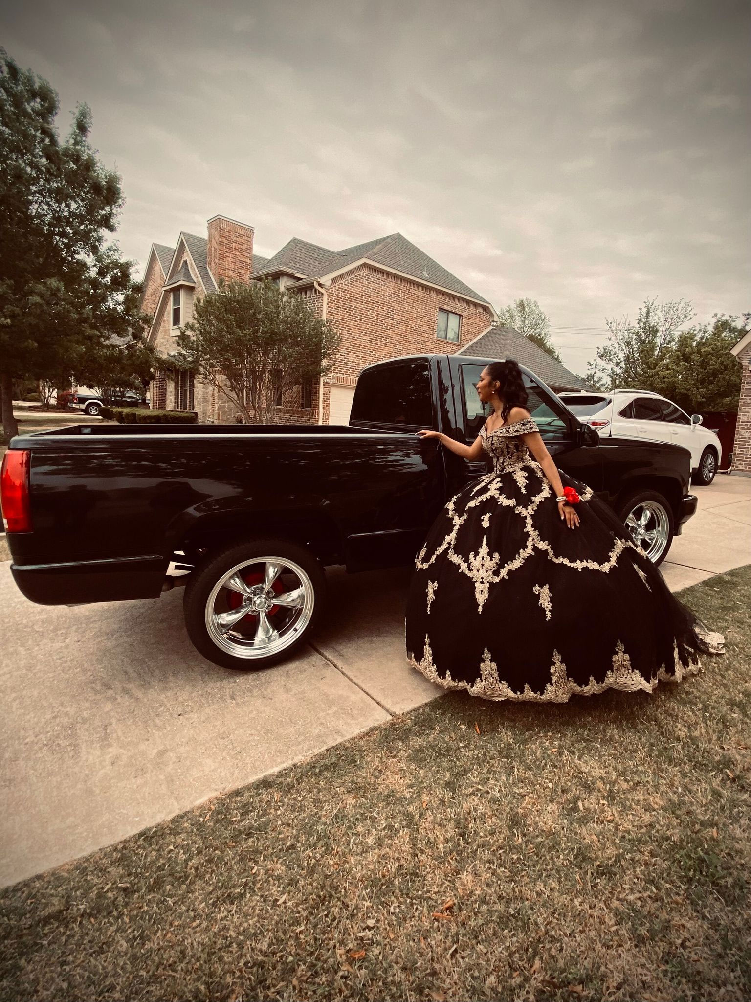 Me being dramatic for my prom and admiring my dad’s truck